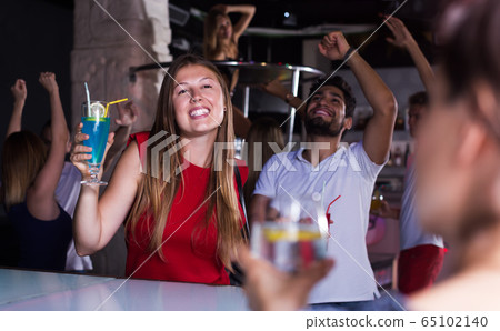 People joying in nightclub People joying in nightclub 65102140