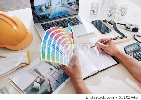 Designer working on color scheme 65102446