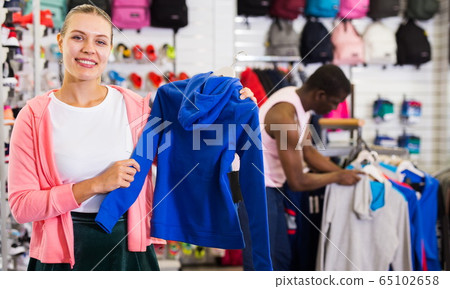 Girl buying sportswear Girl buying sportswear 65102658