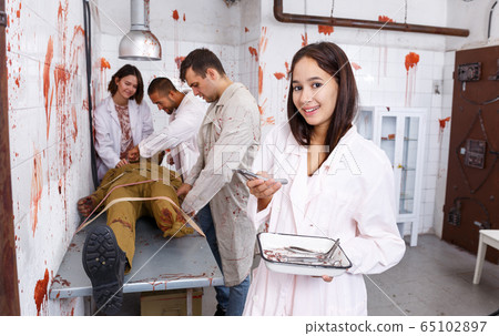 Smiling girl in lost room with bloody walls Smiling girl in lost room with bloody walls 65102897