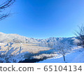 Snowy landscape and blue sky 65104134