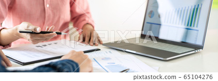 Business team working with plan on office desk Business team working with plan on office desk 65104276