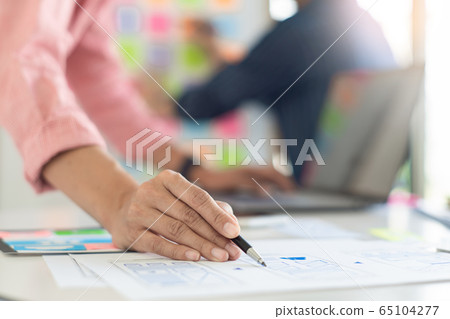 Graphic designers team work together with UX UI Graphic designers team work together with UX UI 65104277