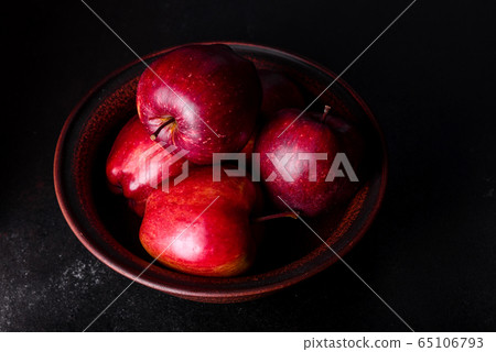 Fresh juicy red apple with droplets of water Fresh juicy red apple with droplets of water 65106793