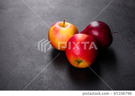 Fresh juicy red apple with droplets of water Fresh juicy red apple with droplets of water 65106796