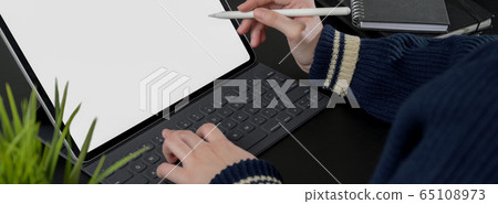 Cropped shot of female freelancer working on Cropped shot of female freelancer working on 65108973