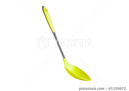 Green spoon on a white background 65109972
