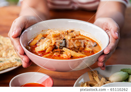 Thai local homemade food red curry with chicken in ceramic bowl 65110262