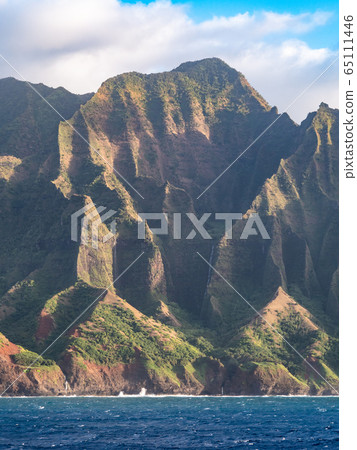 The breathtaking beauty of the sheer cliffs along the Na Pali Coast on Kauai Island, Hawaii. The breathtaking beauty of the sheer cliffs along the Na Pali Coast on Kauai Island, Hawaii. 65111446