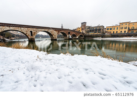 Ponte Pietra and Adige River - Ancient stone bridge in Verona Italy Ponte Pietra and Adige River - Ancient stone bridge in Verona Italy 65112976