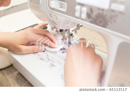 Handmade mask at the hands of women sewing Handmade mask at the hands of women sewing 65113517