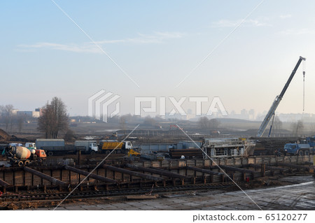 Mobile auto cranes working at construction site. Mobile auto cranes working at construction site. 65120277