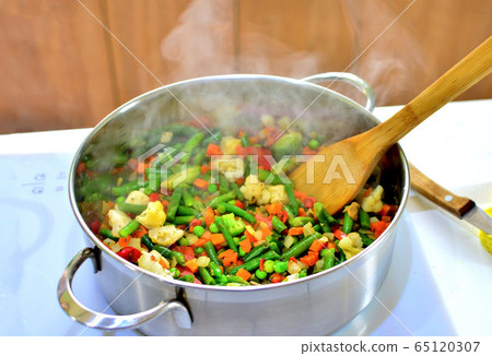 Cooking Steamed Rice with Vegetables. Saucepan 65120307