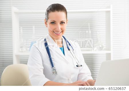 Portrait of woman doctor at hospital Portrait of woman doctor at hospital 65120637