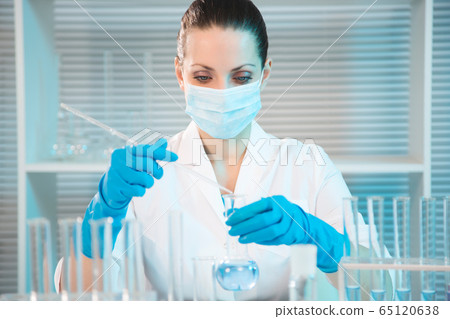 Female scientist working in laboratory Female scientist working in laboratory 65120638