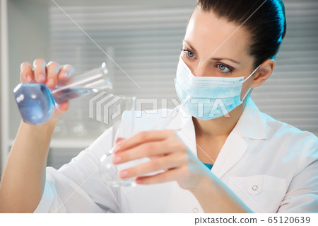 Female scientist working in laboratory Female scientist working in laboratory 65120639