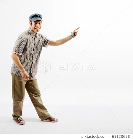 Funny man presenting against white background 65120658