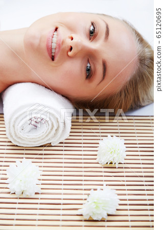 Young beautiful woman in spa environment Young beautiful woman in spa environment 65120695