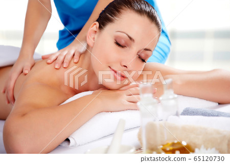 Young beautiful woman in spa environment Young beautiful woman in spa environment 65120730
