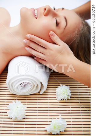 Young beautiful woman in spa environment Young beautiful woman in spa environment 65120734