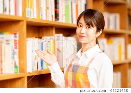 A woman in an apron A woman in an apron 65121458