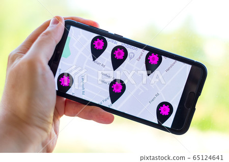 contact tracing app background with hand holding cell phone contact tracing app background with hand holding cell phone 65124641