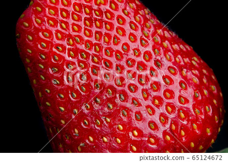 Giant fresh strawberries on a black background with copy space Giant fresh strawberries on a black background with copy space 65124672
