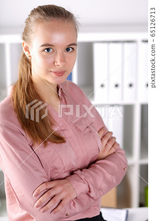 Cute woman working in company Cute woman working in company 65126713