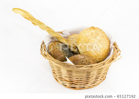 Bread basket with bread rolls and bread sticks. 65127192