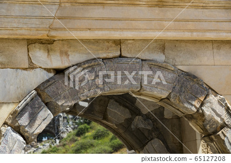 The ruins of the ancient antique city of Ephesus the library building of Celsus, the amphitheater temples and columns. Candidate for the UNESCO World Heritage List The ruins of the ancient antique city of Ephesus the library building of Celsus, the amphitheater temples and columns. Candidate for the UNESCO World Heritage List 65127208