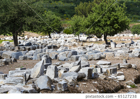 The ruins of the ancient antique city of Ephesus the library building of Celsus, the amphitheater temples and columns. Candidate for the UNESCO World Heritage List The ruins of the ancient antique city of Ephesus the library building of Celsus, the amphitheater temples and columns. Candidate for the UNESCO World Heritage List 65127238