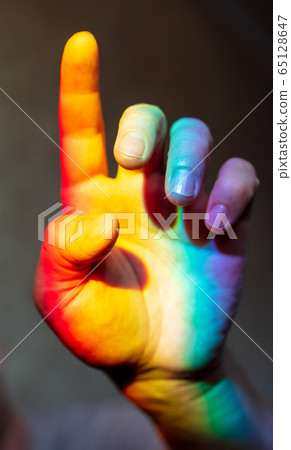 Man's hand in rainbow color Man's hand in rainbow color 65128647