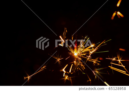 Sparkler background. Christmas and new year Sparkler background. Christmas and new year 65128958