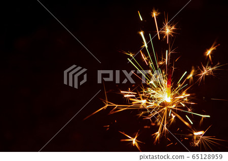 Sparkler background. Christmas and new year Sparkler background. Christmas and new year 65128959