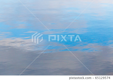 Reflection of the sky on the surface of the water Reflection of the sky on the surface of the water 65129574