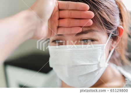 Sick asian woman have hight fever flu and man Sick asian woman have hight fever flu and man 65129800