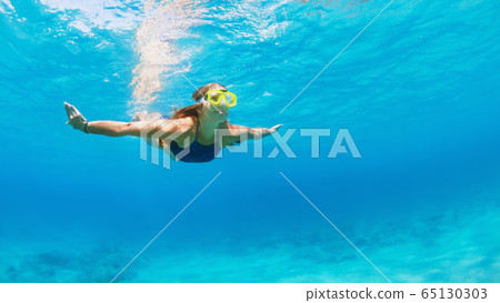 Active young woman in snorkeling mask dive, swim Active young woman in snorkeling mask dive, swim 65130303