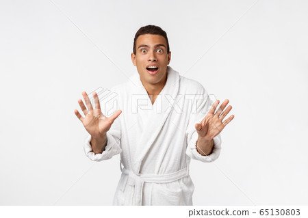 Hurray and cheers. Portrait of handsome shirtless young african american man looking excited while standing against white background 65130803