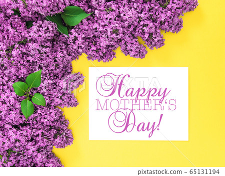 Lilac flowers yellow background Happy Mothers Day 65131194