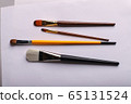 Art brushes of different sizes on a white background. Four painting brushes, horisontal shot 65131524