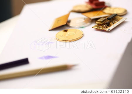 Golden ethereum coin lying at table closeup Golden ethereum coin lying at table closeup 65132140