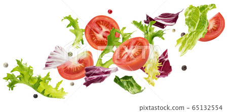 Falling salad of leaves with rucola, lettuce, radicchio, romano green frize and tomatoes Falling salad of leaves with rucola, lettuce, radicchio, romano green frize and tomatoes 65132554