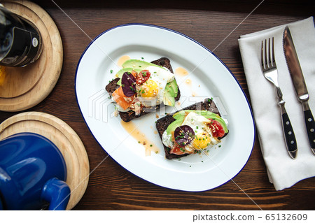 Breakfast rye toast with avocado poched egg salmon 65132609