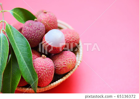 Lychee slice peeled on red pink background - Fresh 65136372