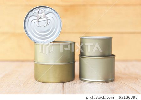 Various canned food in metal cans on wooden Various canned food in metal cans on wooden 65136393