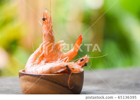 Cooking seafood shrimps prawns served on a wooden 65136395
