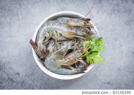 fresh shrimp on white bowl for cooking seafood - fresh shrimp on white bowl for cooking seafood - 65136399