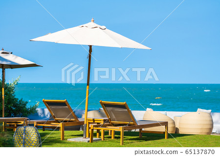 Umbrella and chair around beach sea ocean 65137870