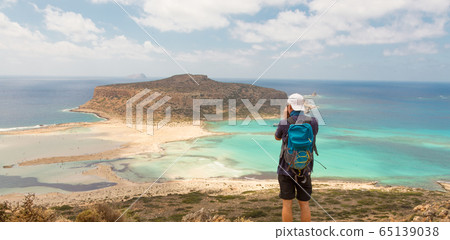Tourist taking photo of Balos beach at Crete island in Greece Tourist taking photo of Balos beach at Crete island in Greece 65139038