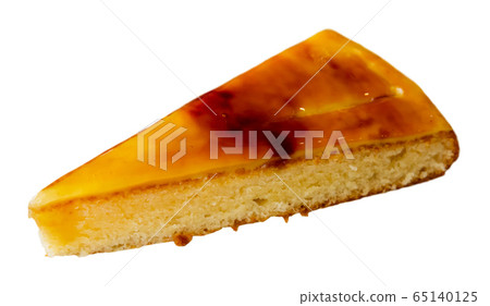 Piece of tasty Catalan cream pie closeup 65140125